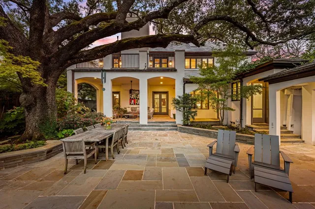 a front view of a house with a outdoor seating