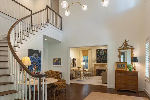 a view of entryway livingroom and hall with wooden floor
