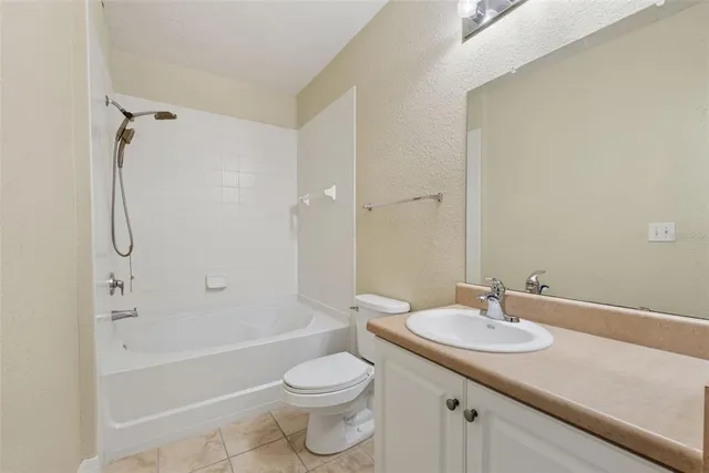 a view of a backyard with table and chairs and trees