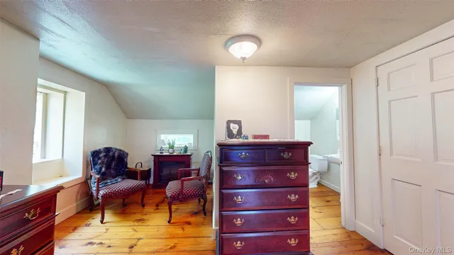 a bed room with a bed and a dresser