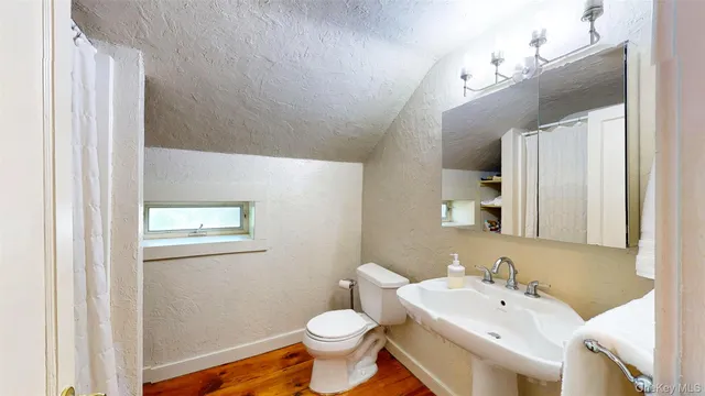 a view of a hallway with furniture