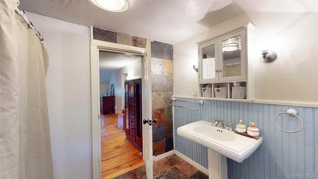 a bed room with a bed and a night stand