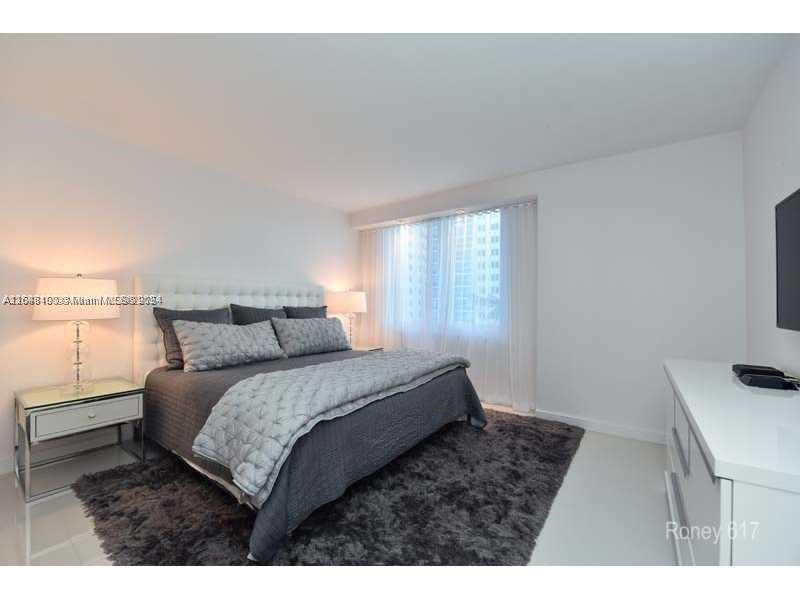 2301 Collins Avenue, Unit 617 Miami Beach, FL 33139 - Photo 5 of 8 a bedroom with a bed and a window