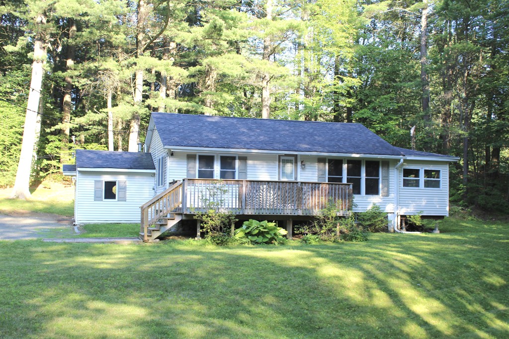 1663 Russell Road Montgomery, MA 01085 - Photo 1 of 17 front view of a house with a yard