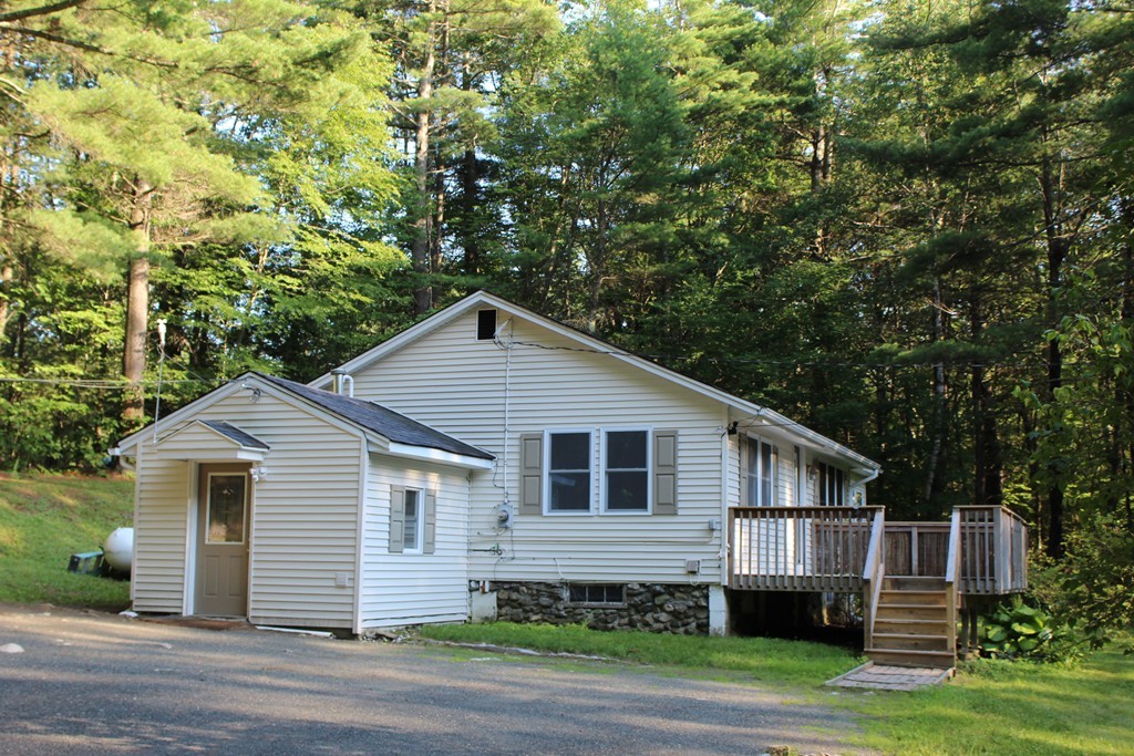 1663 Russell Road Montgomery, MA 01085 - Photo 16 of 17 a front view of a house with a garden