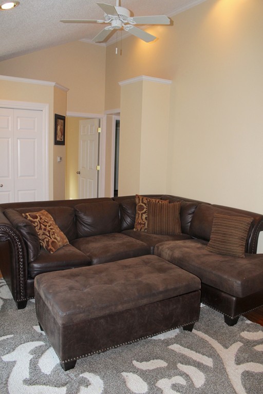 1663 Russell Road Montgomery, MA 01085 - Photo 7 of 17 a living room with a couch and a ceiling fan