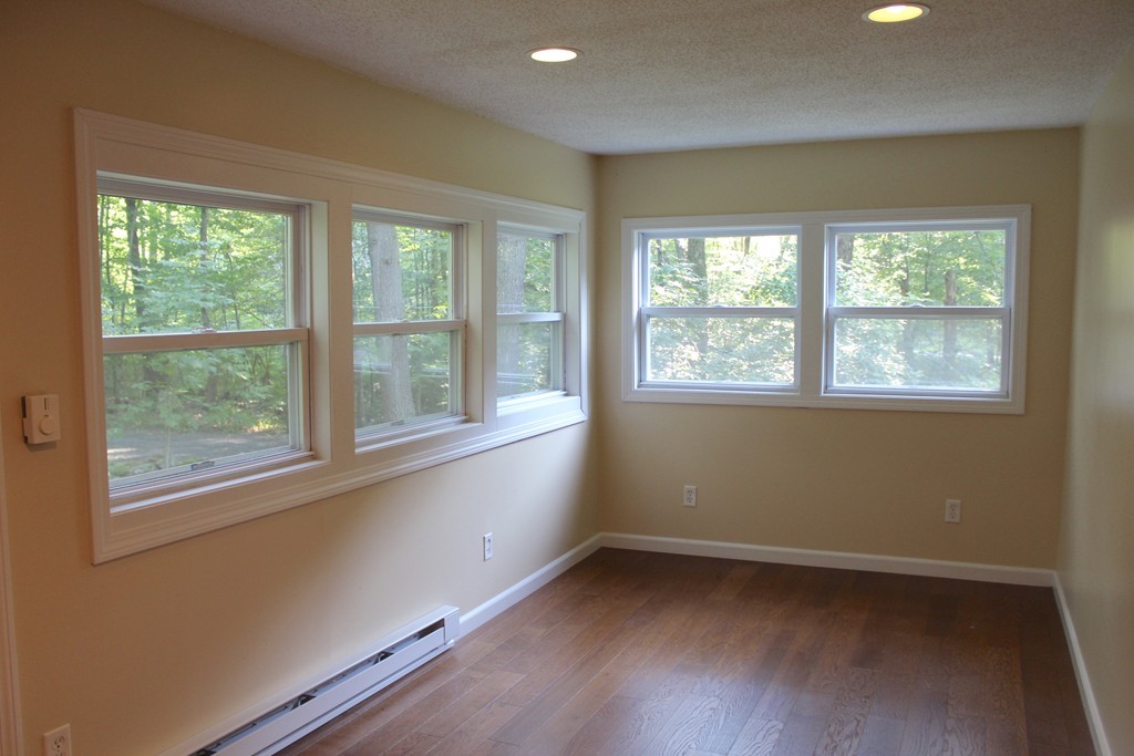 1663 Russell Road Montgomery, MA 01085 - Photo 9 of 17 a view of an empty room with wooden floor and a window