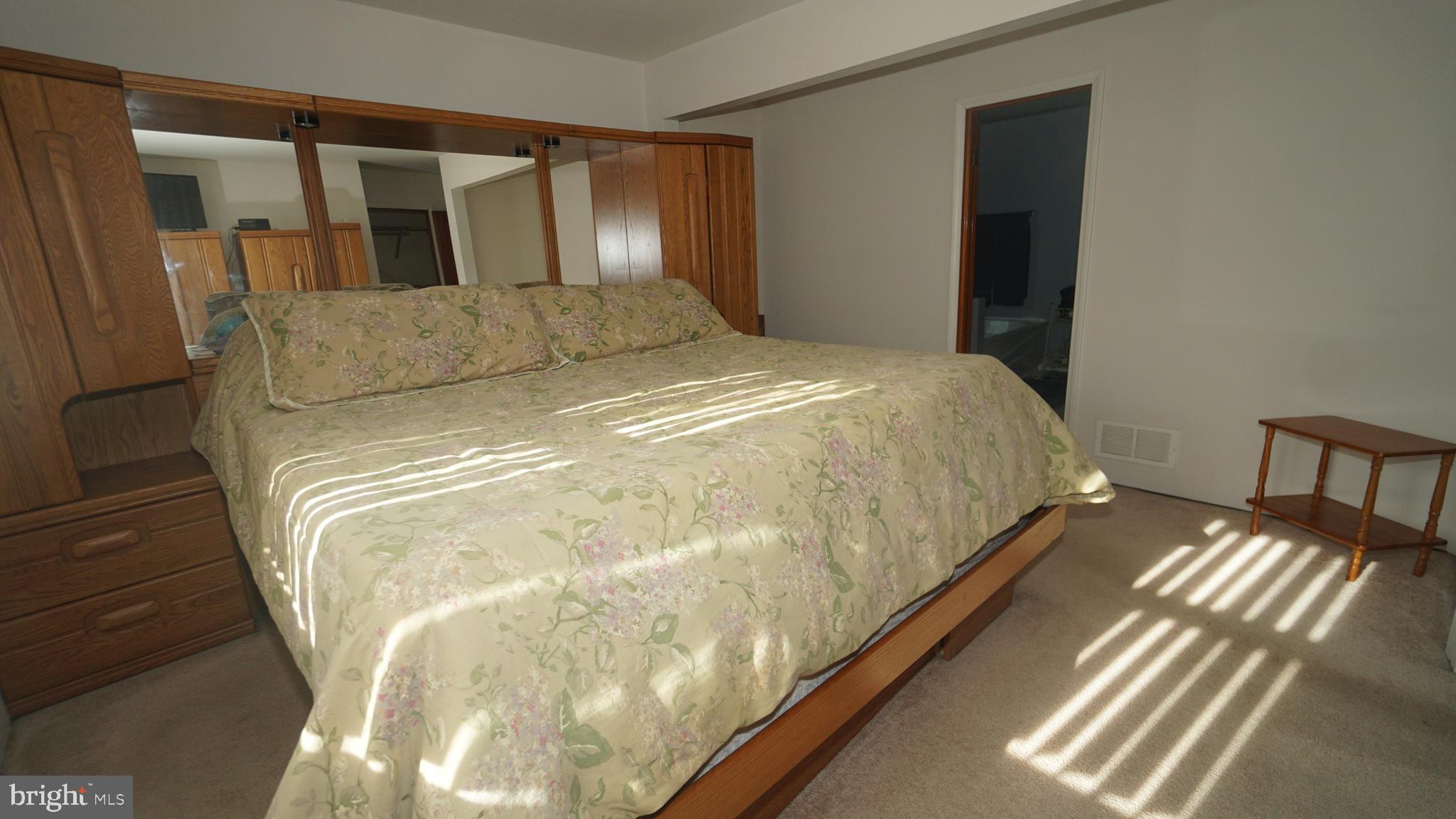 2307 State Rd. Croydon, PA 19021 - Photo 11 of 36 a bed sitting in a bedroom next to a window