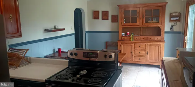 a kitchen with a stove and a refrigerator