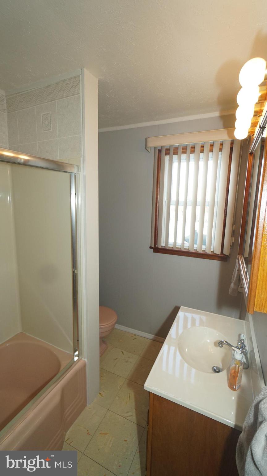 2307 State Rd. Croydon, PA 19021 - Photo 18 of 36 a bathroom with a sink a toilet and shower