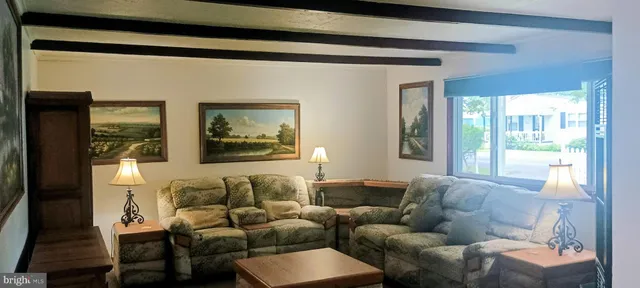 a living room with furniture and a window