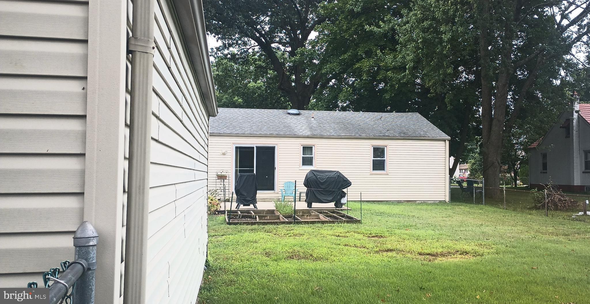 2307 State Rd. Croydon, PA 19021 - Photo 30 of 36 a backyard of a house with table and chairs