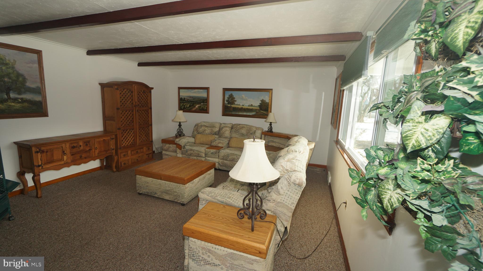 2307 State Rd. Croydon, PA 19021 - Photo 4 of 36 a living room with furniture and a potted plant
