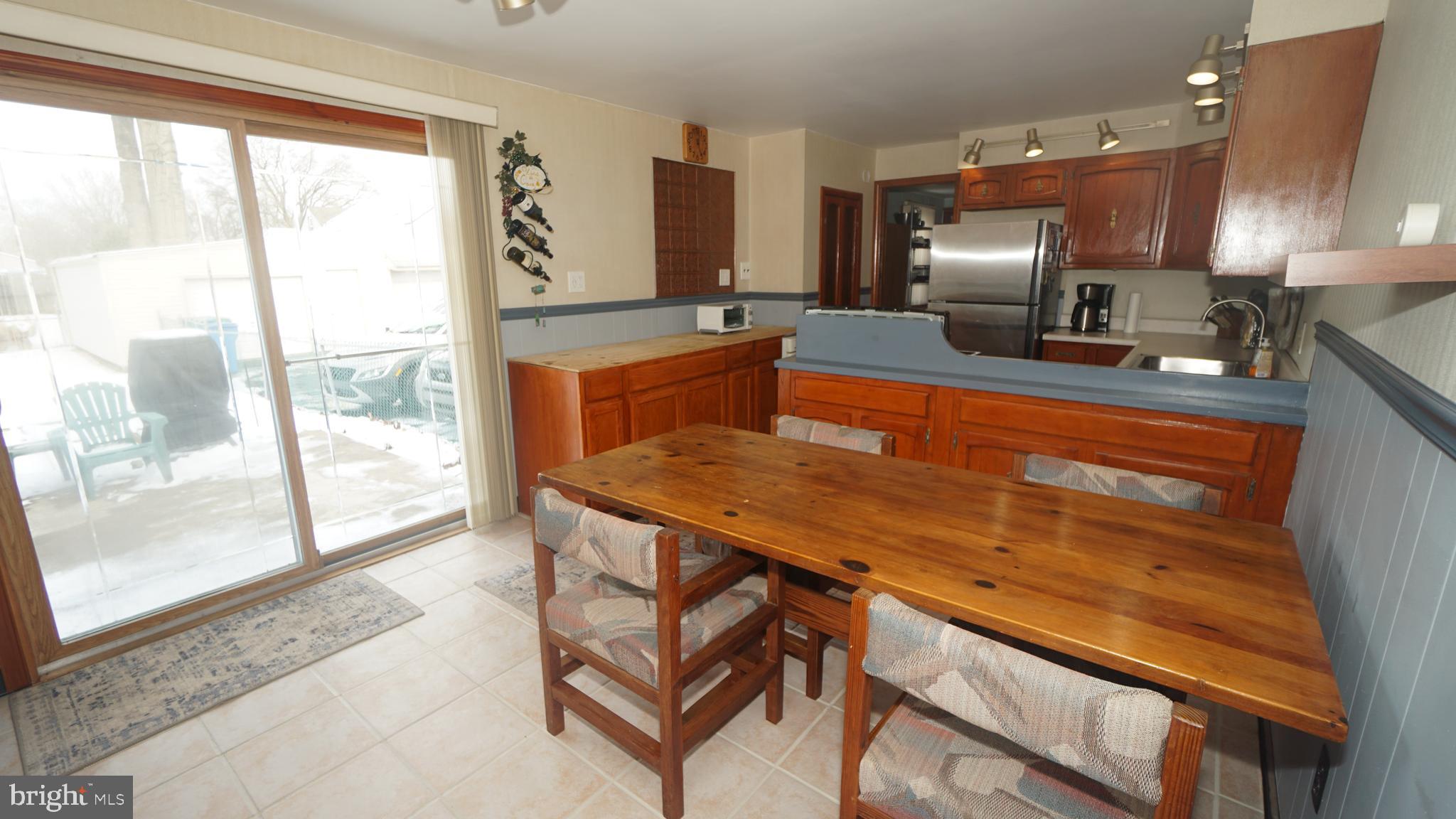 2307 State Rd. Croydon, PA 19021 - Photo 8 of 36 a kitchen with a sink a counter top space and stainless steel appliances