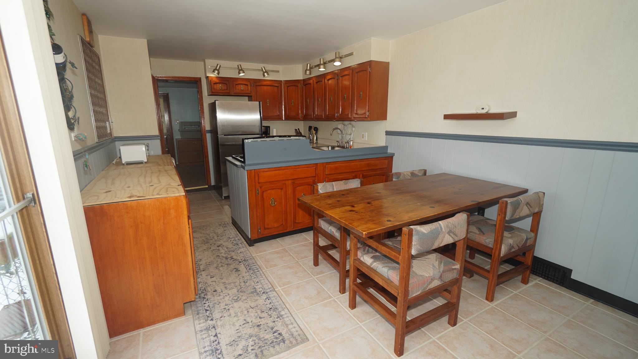 2307 State Rd. Croydon, PA 19021 - Photo 9 of 36 a kitchen with a refrigerator and a stove
