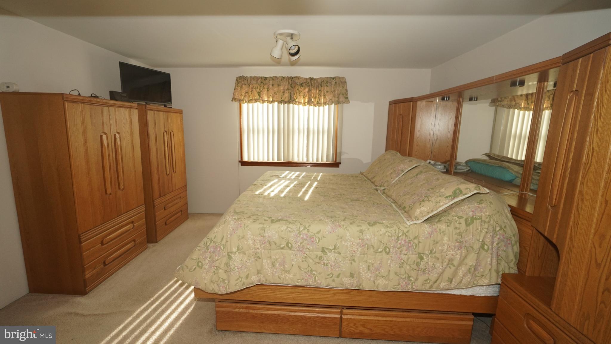 2307 State Rd. Croydon, PA 19021 - Photo 10 of 36 a bed sitting in a spacious bedroom next to a window