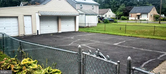 a front view of a house with a yard and a garage