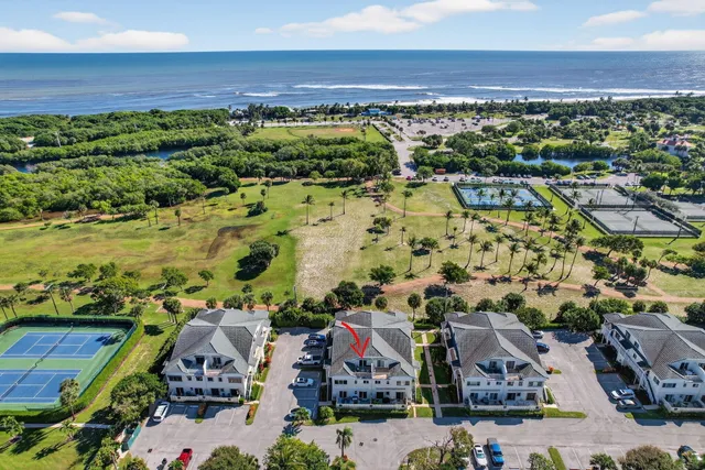 an aerial view of residential houses with outdoor space