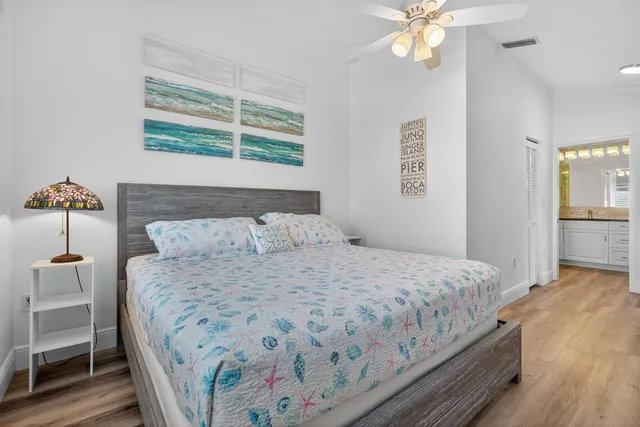 a bathroom with a granite countertop shower and a sink