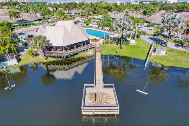 an aerial view of a house with a lake view