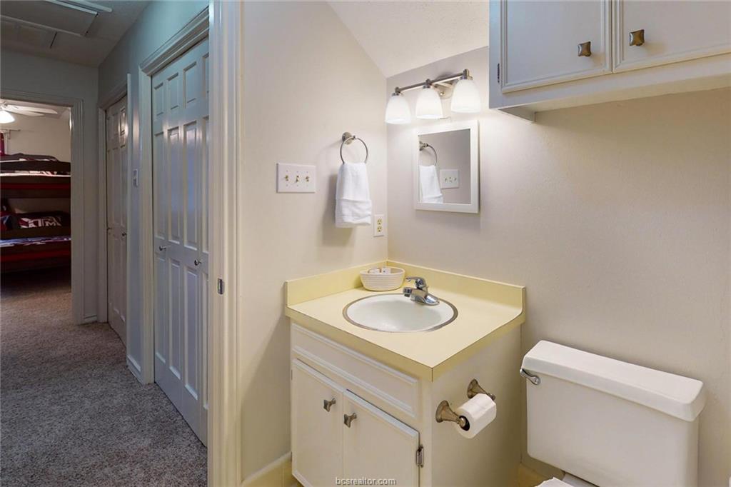 900 Westview Street Bryan, TX 77802 - Photo 26 of 30 a bathroom with a sink and a mirror