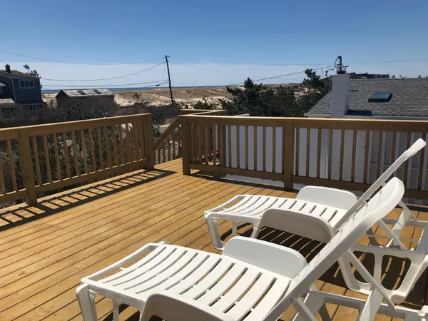 a view of a balcony with wooden floor