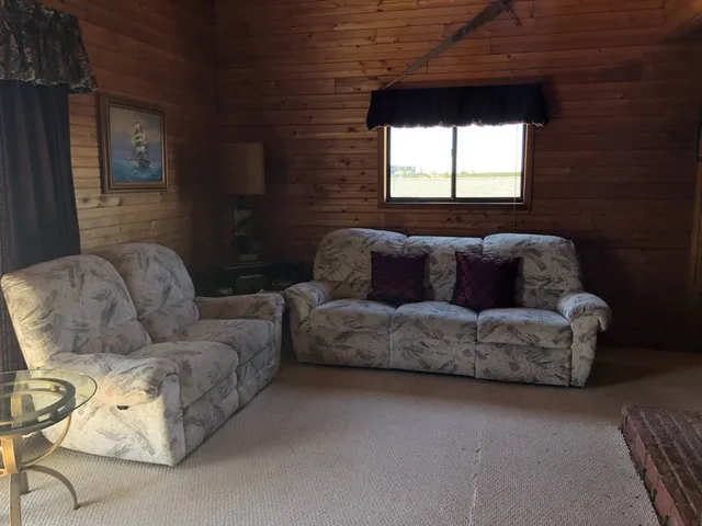 a living room with furniture and a window