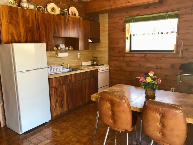 a kitchen with sink cabinets and refrigerator