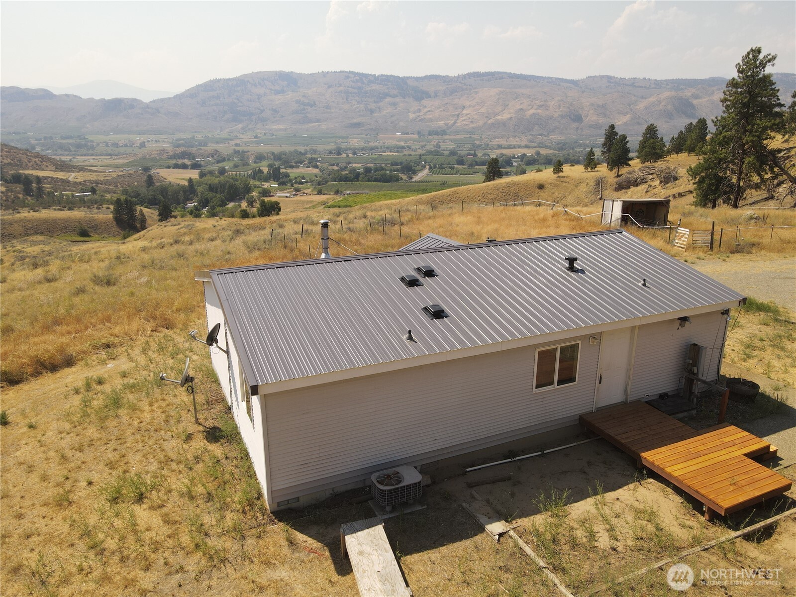105 Swanson Mill Road Oroville, WA 98844 - Photo 8 of 37 a view of a terrace with a mountain