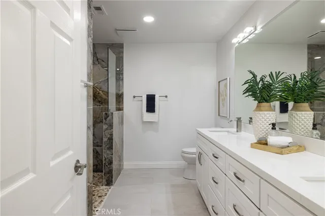 a bathroom with a sink a vanity and a mirror