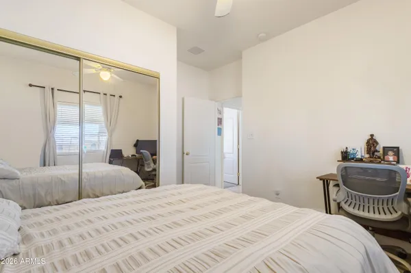 a bedroom with a bed and a dresser