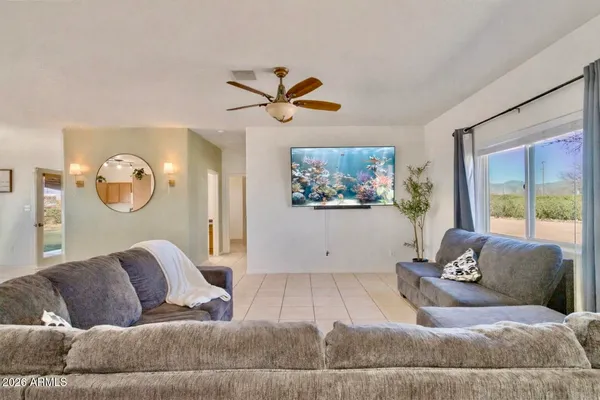 a living room with furniture and a large window