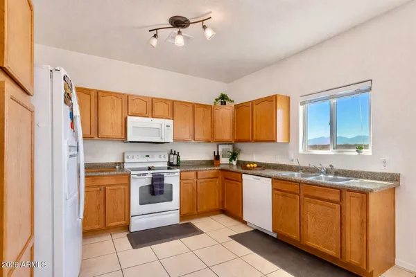 a kitchen with stainless steel appliances granite countertop a sink and cabinets