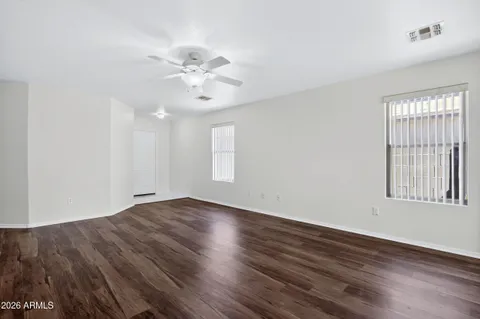 a kitchen with stainless steel appliances granite countertop a sink a stove a refrigerator cabinets and island