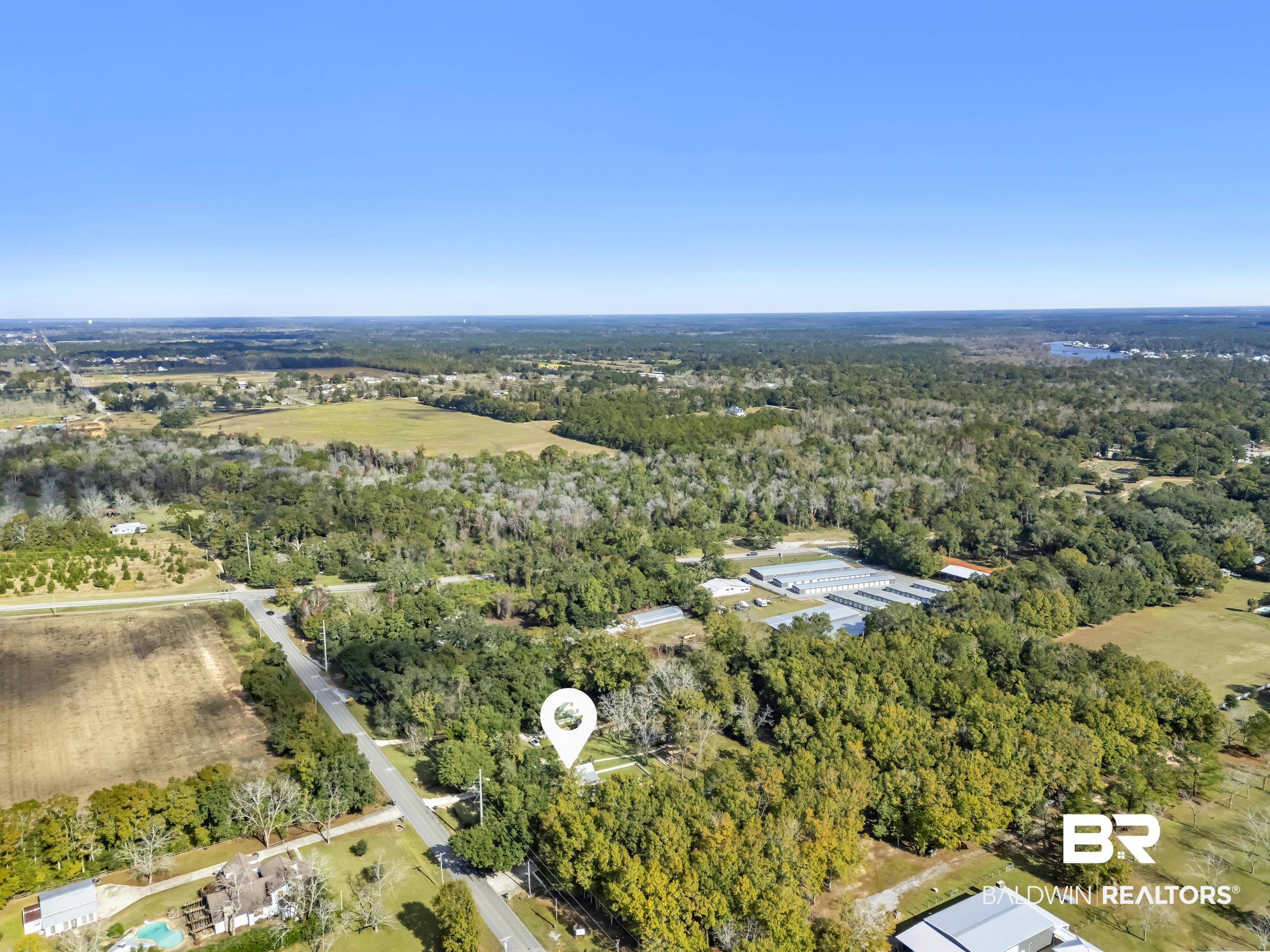13232 Mary Ann Bch Road Fairhope, AL 36532 - Photo 67 of 79 Aerial view of property and surrounding area featuring a forest