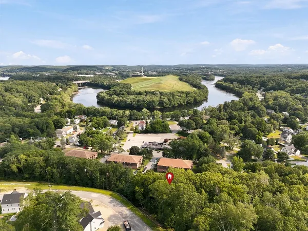 an aerial view of residential building and lake
