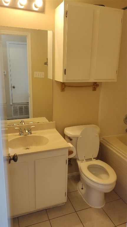 10001 Parliament House Road, Unit A Austin, TX 78717 - Photo 14 of 19 a white toilet sitting next to a bathroom sink
