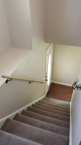 a bedroom with a bed and cabinets