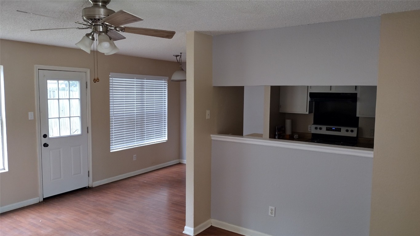 10001 Parliament House Road, Unit A Austin, TX 78717 - Photo 4 of 19 a living room with furniture and a flat screen tv