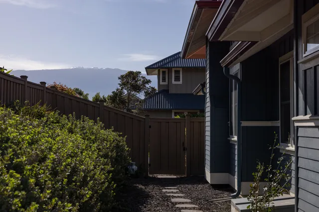 a house with trees in the background
