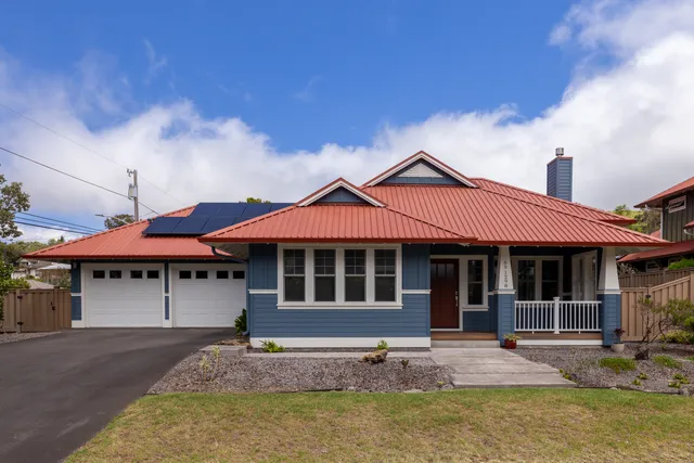 a front view of a house with sitting area