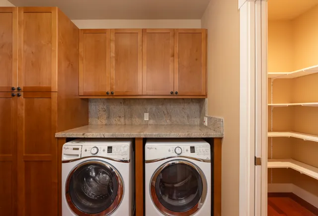 a view of storage and utility room with washer and dryer