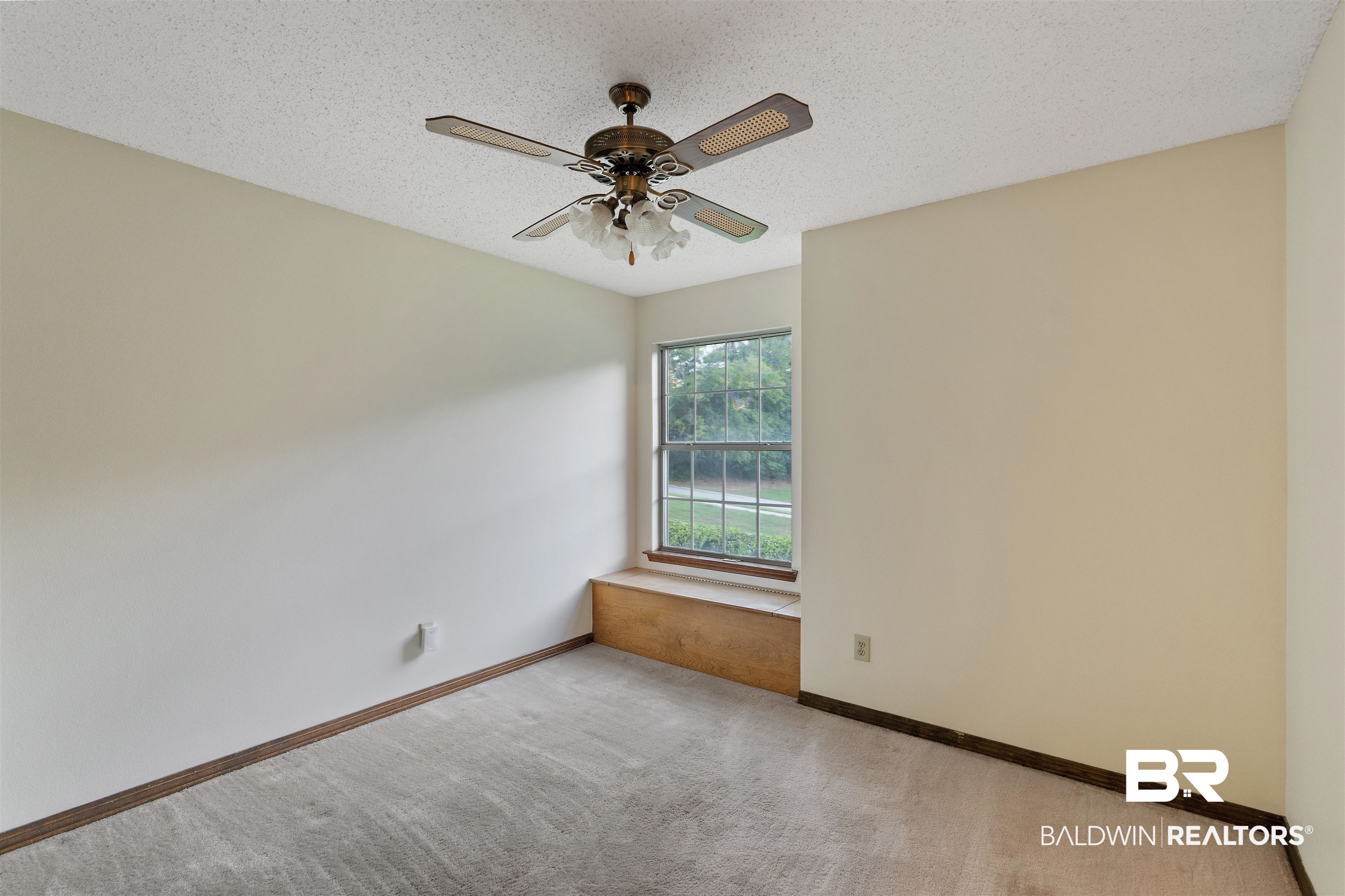 438 Ridgewood Drive Daphne, AL 36526 - Photo 16 of 28 Carpeted empty room featuring a textured ceiling and ceiling fan