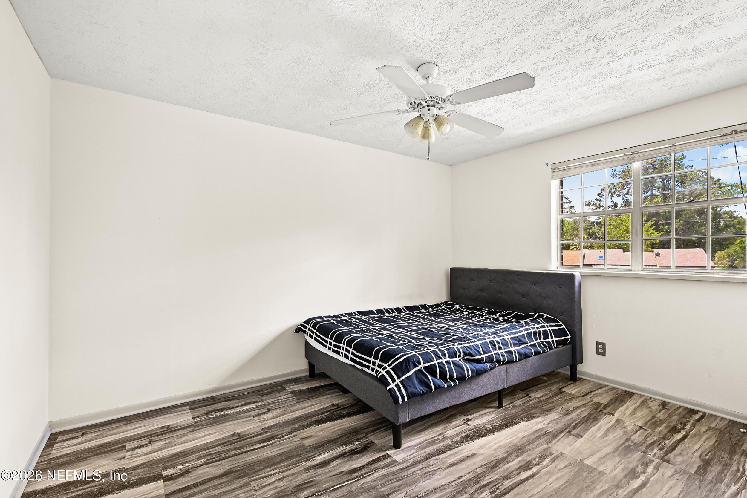 4915 Baymeadows Road, Unit 6G Jacksonville, FL 32217 - Photo 26 of 44 a bedroom with a bed and window