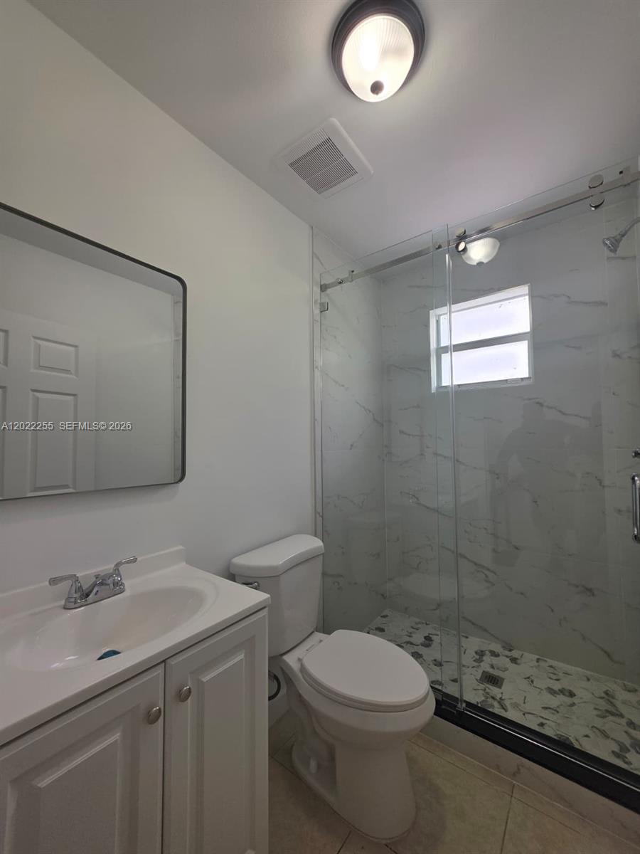 829 Southwest 3rd Street, Unit 831 Miami, FL 33130 - Photo 17 of 21 a bathroom with a sink toilet and shower