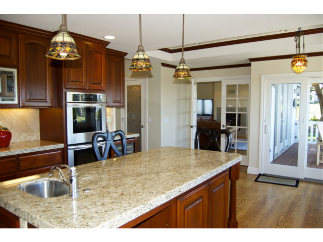 18 Ashdown Place Half Moon Bay, CA 94019 - Photo 5 of 23 a kitchen view with granite countertop a sink and a refrigerator
