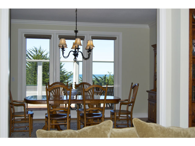 18 Ashdown Place Half Moon Bay, CA 94019 - Photo 8 of 23 a view of a dining room with furniture wooden floor and chandelier