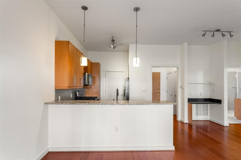 870 Inman Village Parkway Northeast, Unit 203 Atlanta, GA 30307 - Photo 11 of 43 a bathroom with a sink and a mirror