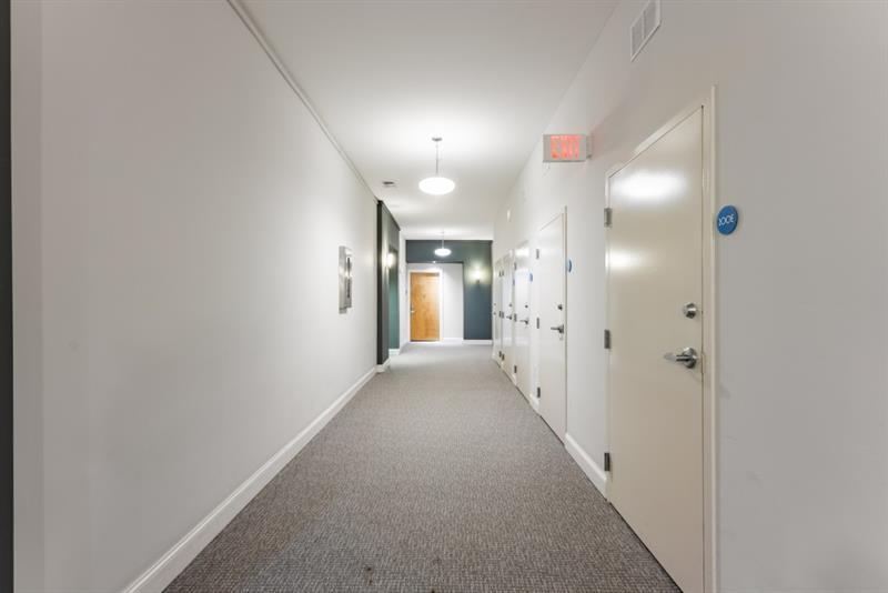 870 Inman Village Parkway Northeast, Unit 203 Atlanta, GA 30307 - Photo 18 of 43 a view of a hallway with wooden floor