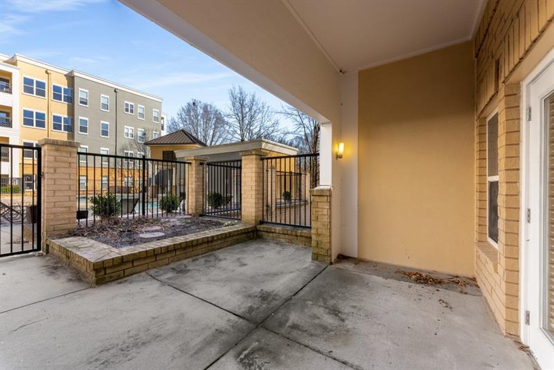 870 Inman Village Parkway Northeast, Unit 203 Atlanta, GA 30307 - Photo 20 of 43 a view of the house with patio